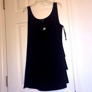 Sleeveless ruffle front tank top.